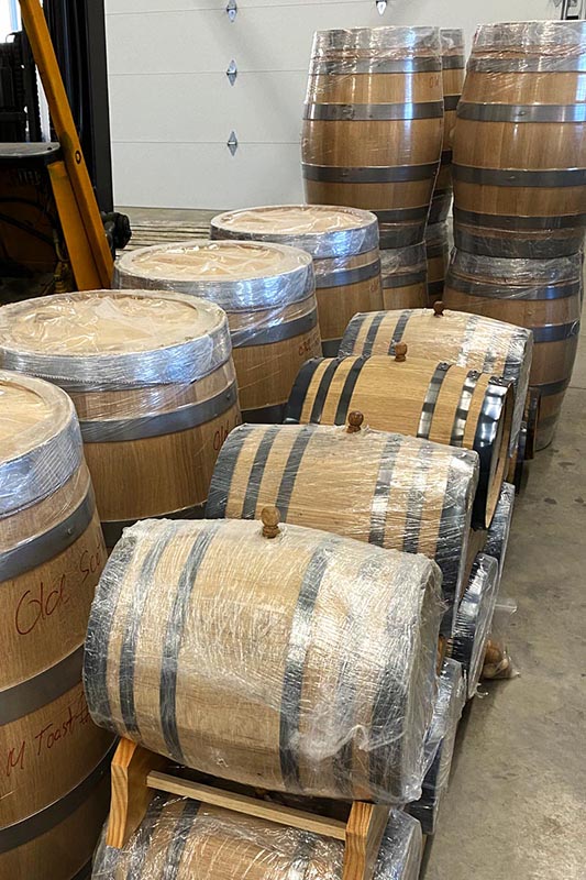 Whiskey barrels await aging